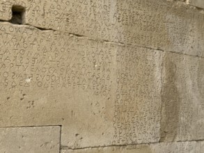 Detailed view of sandstone blocks Stones made of sandstone with written laws carved into the wall