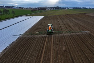 A field is treated with pesticides