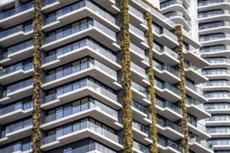 Facade of the Eden Tower on Europa-Allee in Frankfurt am Main, green facade, residential building,