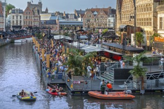Visitors on grandstand at the Graslei watching Pole Pole podium during Gentse Feesten, Ghent city