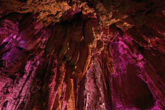 Stalactites illuminated by coloured light, stalactite cave, Höllgrotten, Baar, Canton Zug,
