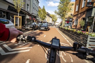 Cycling in the city, city centre road, cycle lane, two-wheeled traffic has priority, 30 km/h zone,