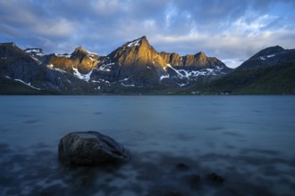 Landscape with sea and mountains on the Lofoten Islands, view over the fjord Flakstadpollen to the