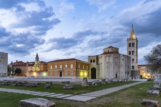 The Church of St Donatus, remains of the Roman forum and the bell tower of Zadar Cathedral at dusk,