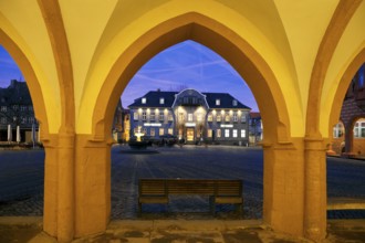 View from the open hall of the late Gothic town hall in Goslar in the evening onto the market