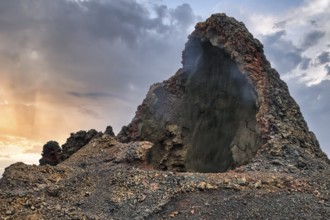 Cave, smoke, volcanic landscape of the Fire Mountains, Montañas del Fuego, Timanfaya National Park,