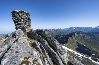 Cairn at the summit of Rundfjellet, view of mountains and fjord landscape, Svolvaer, Nordland,