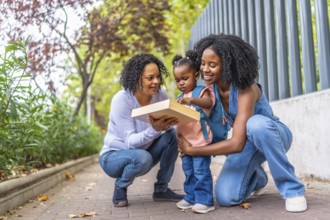 African female family of two generations having fun at the end of a school day