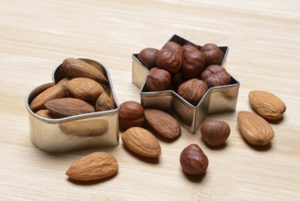 Nuts and cookie cutters, almonds and hazelnuts