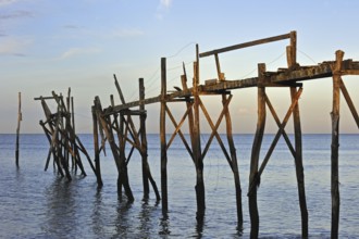 Remains of wooden walkway of traditional carrelet fishing hut on the beach, Loire-Atlantique,