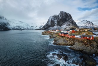 Hamnoy fishing village with red rorbu houses in Norwegian fjord in winter. Lofoten Islands, Norway,