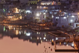 PUSHKAR, INDIA, NOVEMBER 21, 2012: Sacred Puskhar Sagar lake and ghats of Pushkar in twilight in