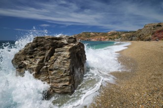 Rocks on Paleochori beach and waves of Aegean sea, Milos island, Cyclades, Greece. Slow motion