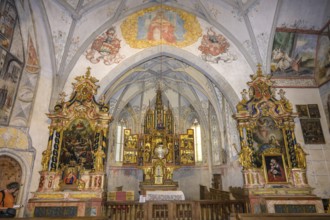 Baroque side altars and late Gothic winged altar in the hospital church, Laces, South Tyrol, Italy,