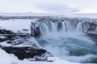 Godafoss waterfall, icy and snowy rock face, snowy landscape, Northern Iceland Eyestra, Iceland,