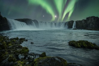 Godafoss waterfall on a night with a beautiful Northern Lights. Iceland