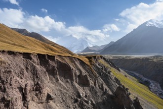 Achik Tash valley between high mountains, mountain landscape with glaciated peak Pik Lenin, Trans
