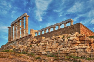 Greece Cape Sounio. Ruins of an ancient temple of Poseidon, Greek god of the sea, on sunset. Shot