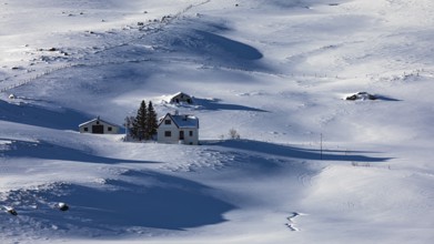 Farmhouse in snow-covered hilly landscape, near Akureyri, North Iceland Eyestra, Iceland, Europe