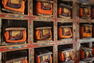 Folios of old manuscripts in library of Thiksey Gompa (Tibetan Buddhist Monastery) . Ladakh, India,
