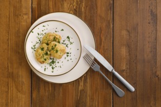 Top view of veal cutlets baked in oven on a plate