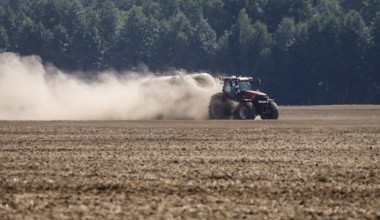 Upper Lusatia, Saxony, Germany - Dust-dry fields in a hot summer, a tractor working the field,