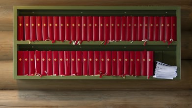 Rule with red hymn books, wooden church, Kvam, Upper Gudbrandsdalen, Norway, Europe