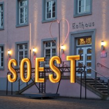 Illuminated town hall in the early evening at the Winterstrahlen Festival of Lights in Soest, North