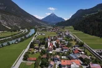 Drone shot, view of village with parish church, Schönwies, Inn, Oberinntal, Tyrol, Austria, Europe