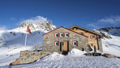 Chamanna d'Es-cha mountain hut in a wintry mountain landscape, Grisons Haute Route ski tour, Albula