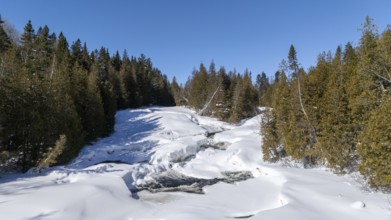 Wolf river. Frozen river in winter. Mastigouche wildlife reserve. Province of Quebec. Canada