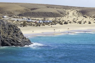 Papagayo beach with blue sea and dunes in a secluded coastal landscape, Playa Blanca, Lanzarote,