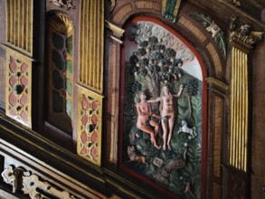 Wood carving of Adam and Eve on the Renaissance pulpit of the Evangelical-Lutheran market church of