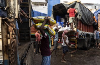 GUWAHATI, INDIA - MAY 1: Labourers carries goods in a wholesale market, in Guwahati, India, on May