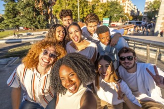 Frontal personal point of view of a multi-ethnic group of friends taking selfie together in the