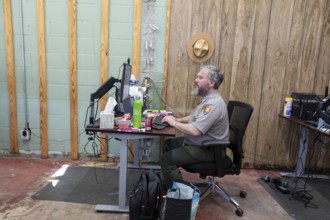 Anniston, Alabama - A National Park Service employee works on clerical duties, at the Freedom