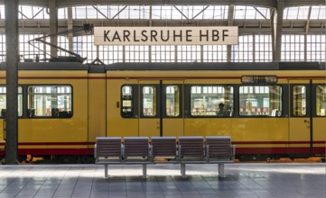 Karlsruhe main station, platform with station sign. Tram in the Karlsruhe public transport network