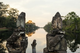 Figures on the bridge to Angkor Thom, sunset, Angkor Wat, Angkor, UNESCO World Heritage Site, Siem