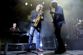 Chris White (L), saxophonist and Terence Reis, singer and guitarist of The Dire Straits Experience,
