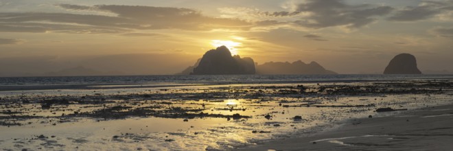 Structures in the sand, sunrise at low tide on the beach of Koh Ngai Island, Andaman Sea, Satun