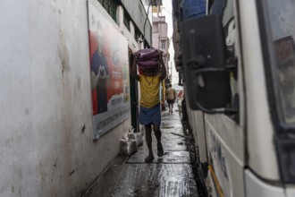 GUWAHATI, INDIA - MAY 1: Labourers carries goods in a wholesale market, in Guwahati, India, on May