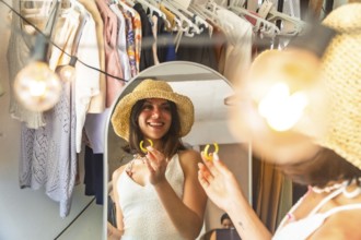 Young woman wearing straw hat trying on yellow earrings, getting ready in front of a mirror in her