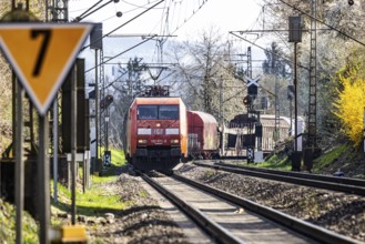 Goods train with a Deutsche Bahn AG locomotive travelling on the open track. Stuttgart,