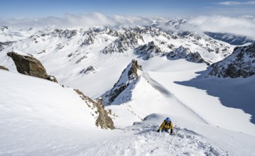 Mountaineer with ice axe and crampons, ascent through steep snowfield to Piz Kesch or Piz d'Es-cha