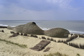 Sandworm by artist Marco Casagrande in the dunes during Beaufort04 at De Haan, Wenduine, Belgium,