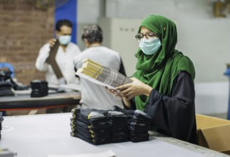Employees of Inter Market Knit Private Limited producing socks. Lahore, 22.08.2024. Photographed on