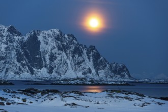 Moonrise, winter landscape, Lofoten island Vestvågøya at the fjord Gimsøystraumen, Lofoten,