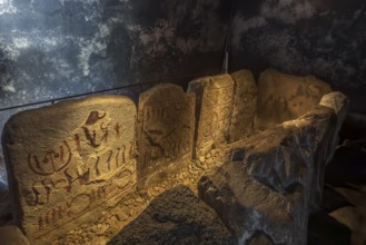 Carved figures in stone slabs inside the King's Tomb, a Bronze Age tomb in Kivik, Simrishamn