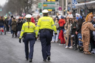 Rose Monday parade in Düsseldorf, police officers on duty at the street carnival, North