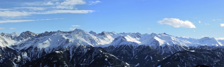 Alpine panorama with snow-covered mountain peaks in winter. Taken in the ski resort of Serfaus Fiss